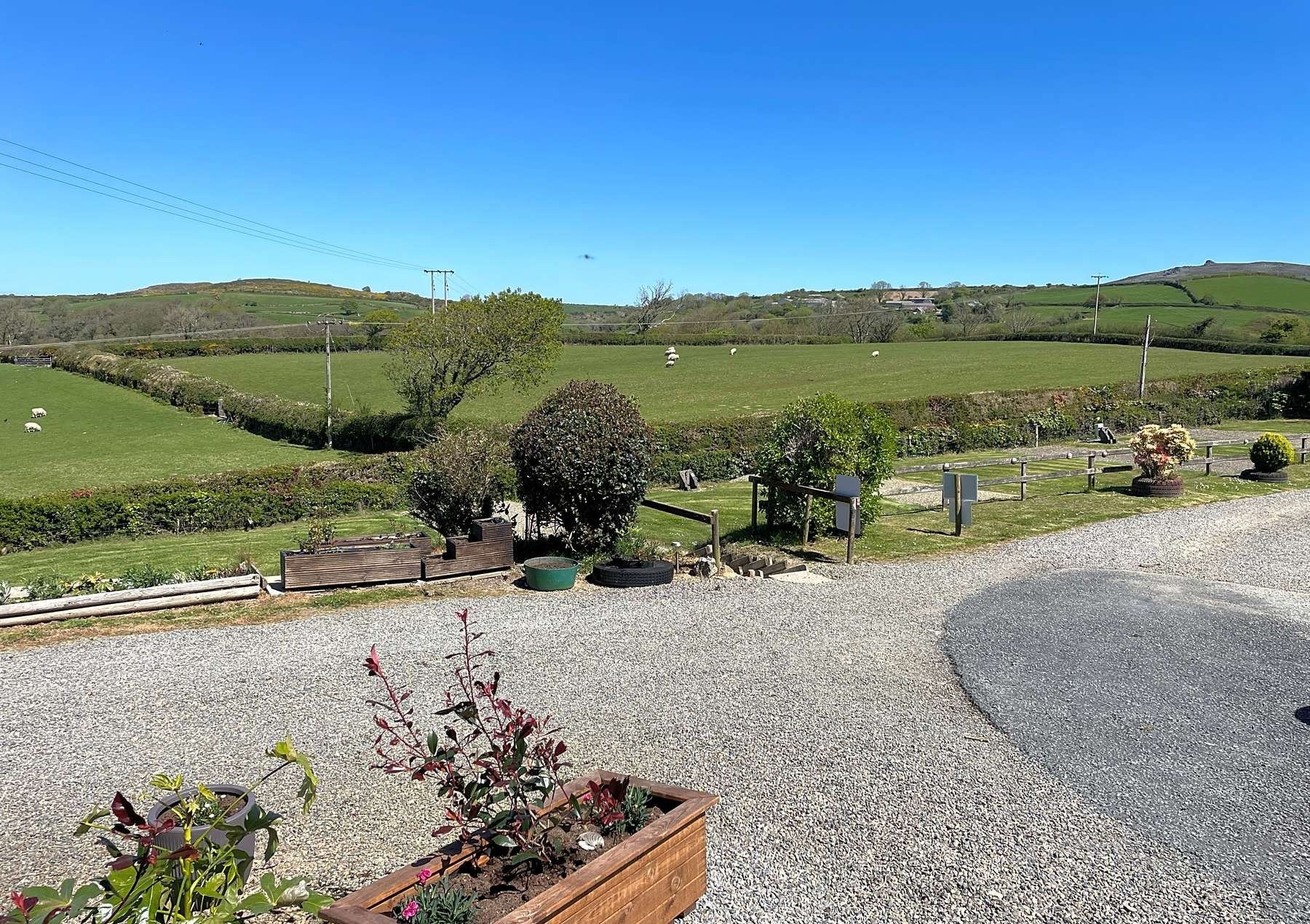 The gravel drive and flower planters at Gwaun Vale
